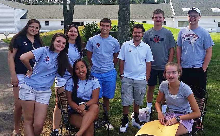 Group of nine student volunteers at the Golf Classic.